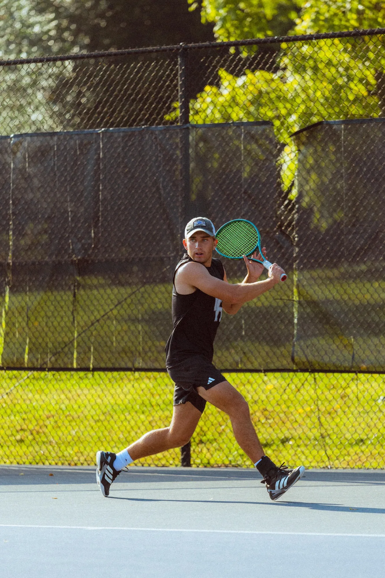 Mason Harmon, PTR Certified Coach at DeMartini Tennis, in his coach portrait.