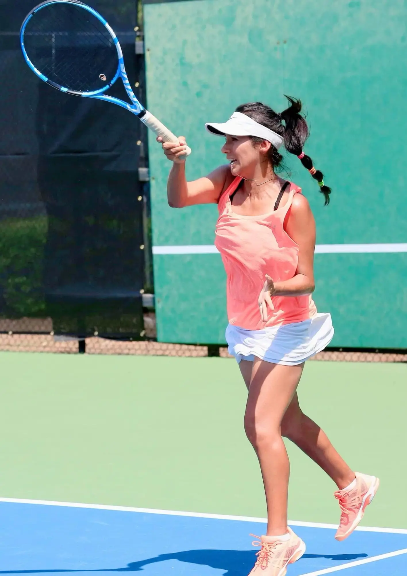 Nanely DeMartini hitting a forehand on a Crooked Creek court